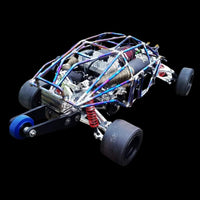 Close-up of a model car chassis with visible components on a black background
