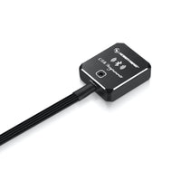 Black electronic device with a cable on a white background