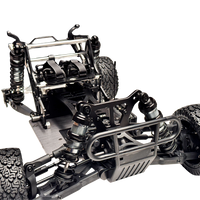 Close-up of a detailed metal chassis of a remote control car on a white background