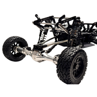 Close-up of a black and silver off-road vehicle chassis on a white background