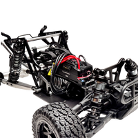 Close-up of a black and silver RC car chassis with visible components on a white background