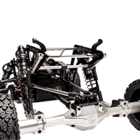 Close-up of a detailed metal chassis with suspension components on a white background