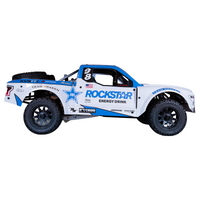 A remote control toy vehicle with a predominantly white body and blue detailing. It features sponsor logos including 'ROCKSTAR ENERGY DRINK'.