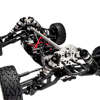 Close-up of a detailed model car chassis with suspension and wheels on a white background