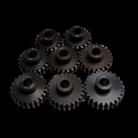 A collection of black carbon steel pinion gears with an 8mm bore designed for use with brushless motors, arranged in four rows on a dark background.