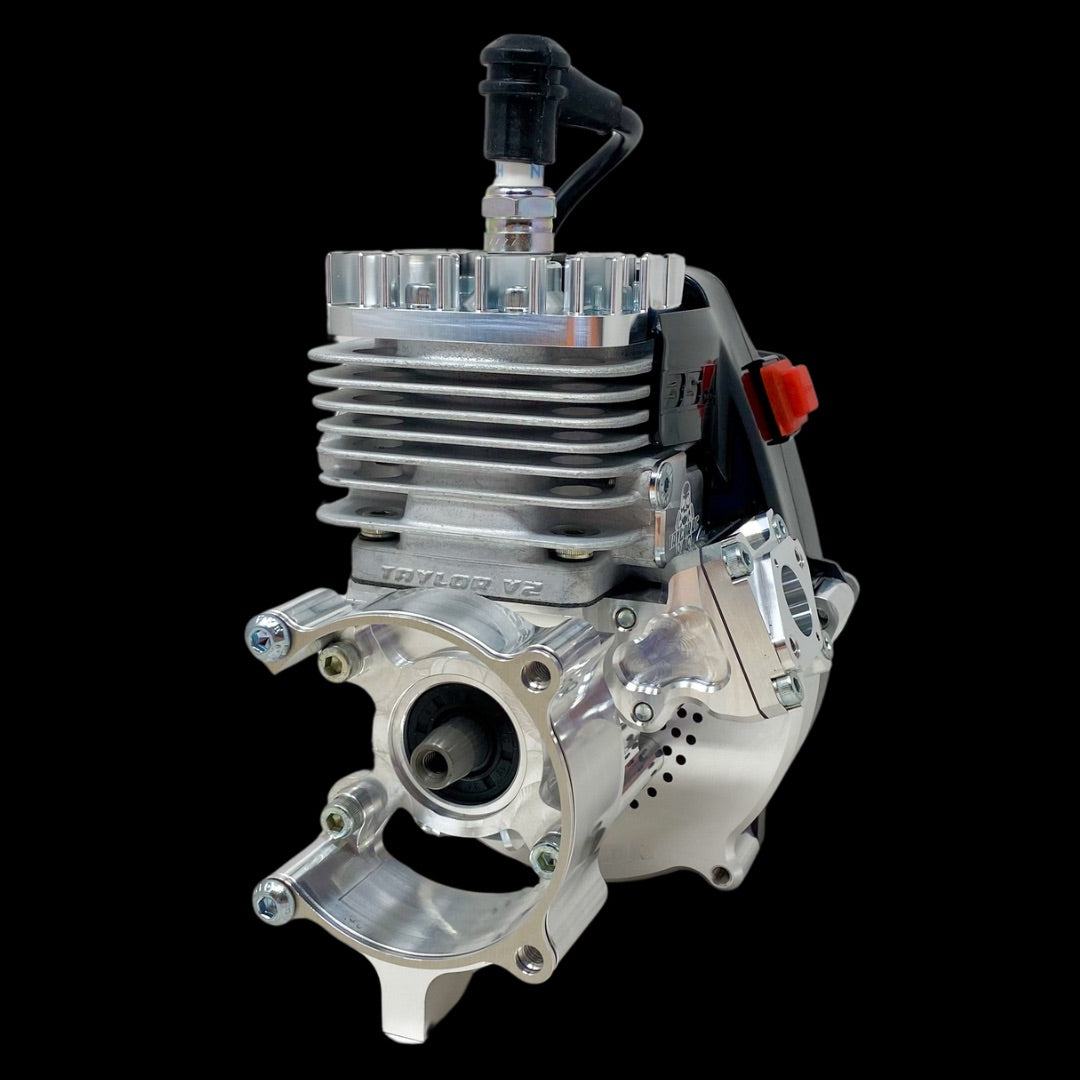 A silver billet reed engine, predominantly used in remote control vehicles, showcasing its intricate design and components.
