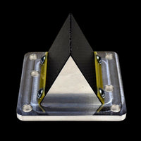 Triangular reed valve with black, yellow, and silver colors on a black background