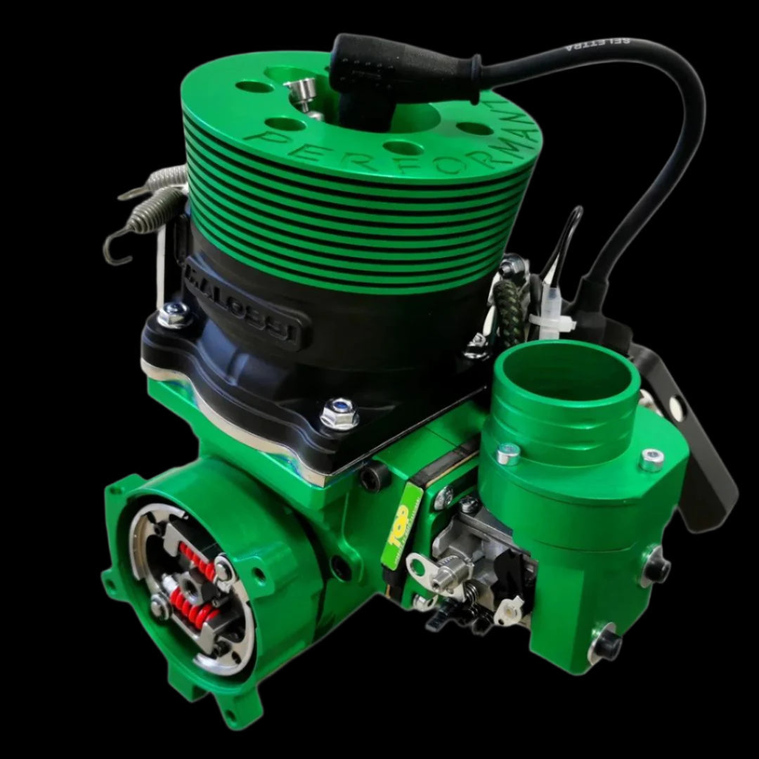 Green engine block with various components on a white background