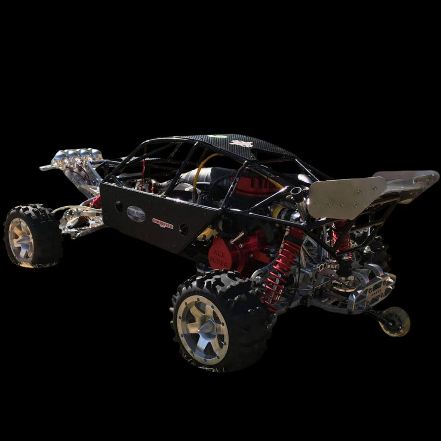 Black off-road vehicle chassis with visible mechanical components on a black background