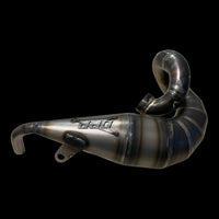 Metallic exhaust tip on a black background