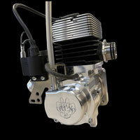 Metallic engine block with visible branding on a black background