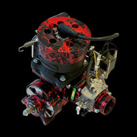Close-up of a red and black engine component on a black background