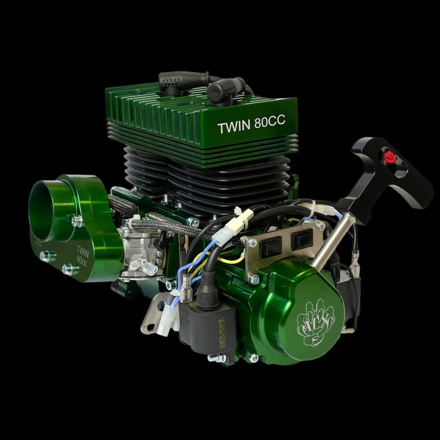 Green twin 80cc engine on a black background