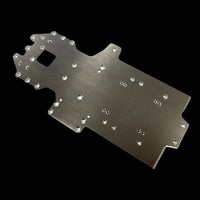 Metallic chassis plate with multiple holes on a black background