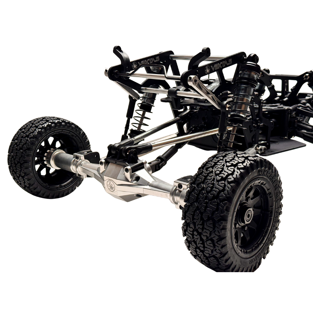 Close-up of a black and silver off-road vehicle chassis on a white background