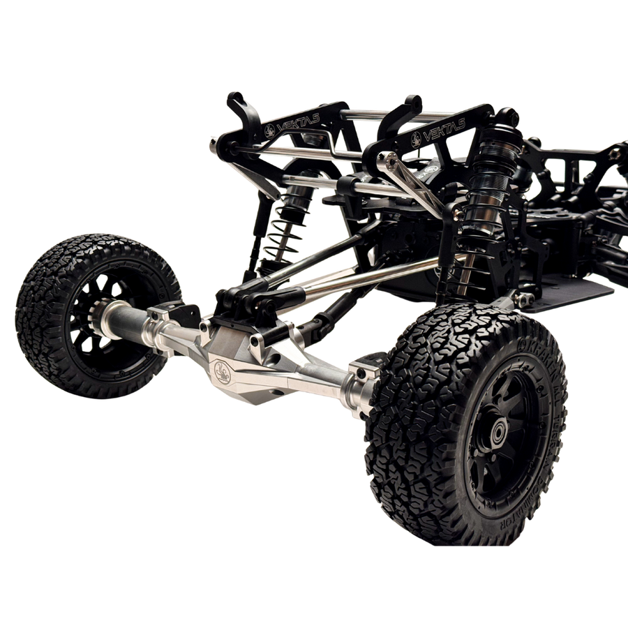 Close-up of a black and silver off-road vehicle chassis on a white background