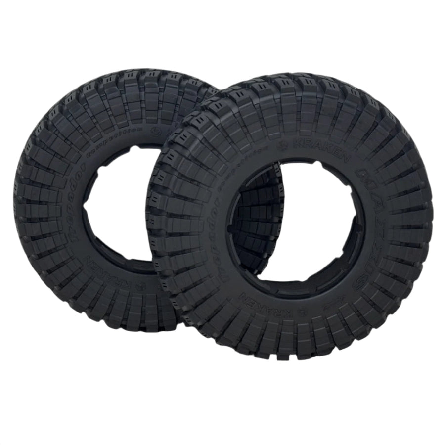 Two black tires with tread patterns on a transparent background