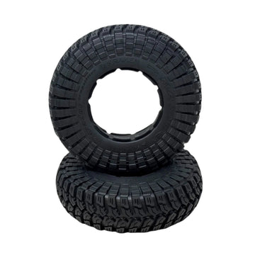 Two black off-road tires with tread pattern on a transparent background