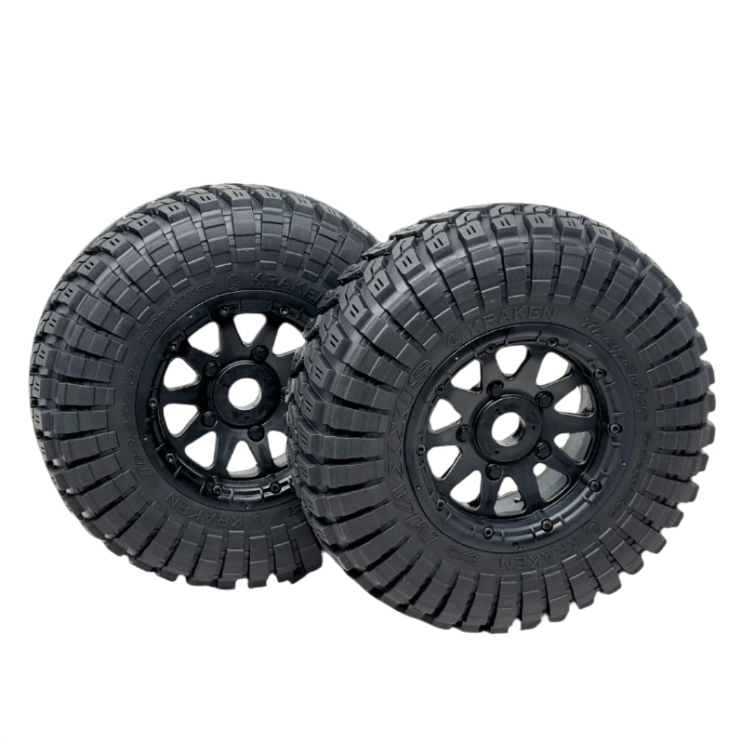 Two black off-road tires with tread patterns on a transparent background