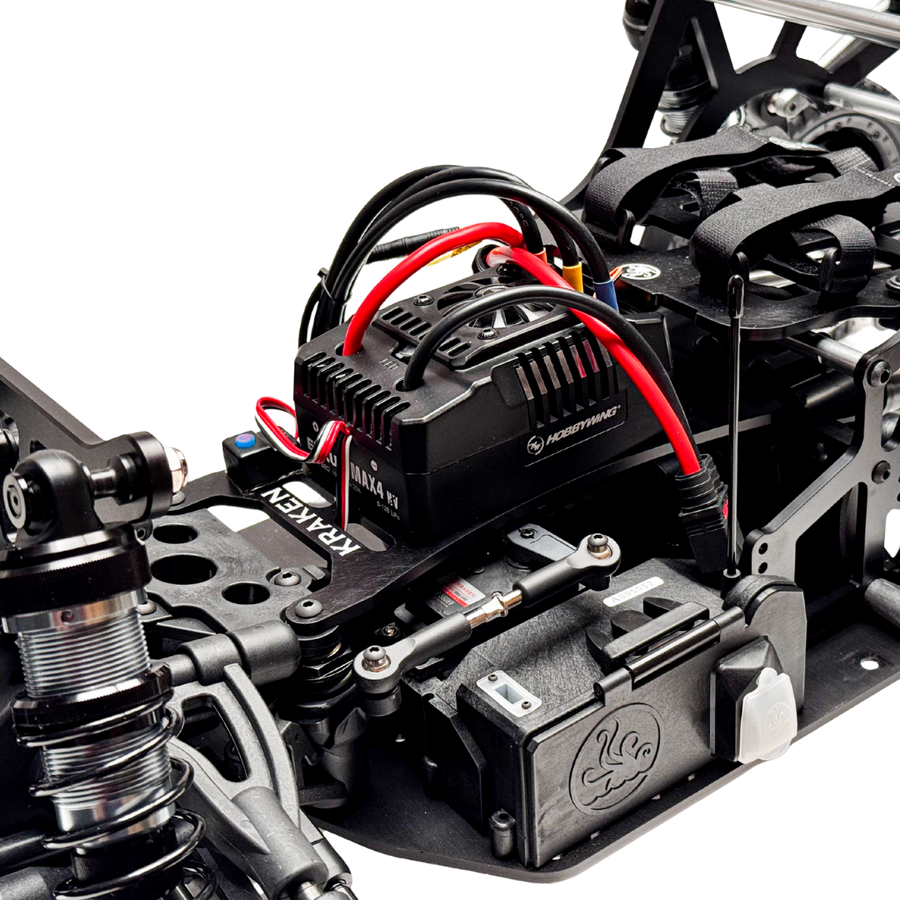 Close-up of a mechanical model with wiring and components on a white background