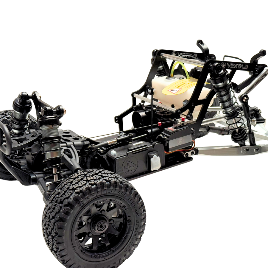 Model of a VEKTA buggy chassis with suspension and wheels on a white background